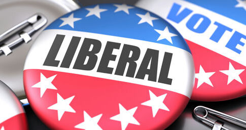 Political buttons reading Liberal and Vote.